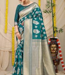 Teal banarasi silk blend saree with zari floral weaving & rich pallu