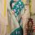 Teal banarasi silk blend saree with zari floral weaving & rich pallu