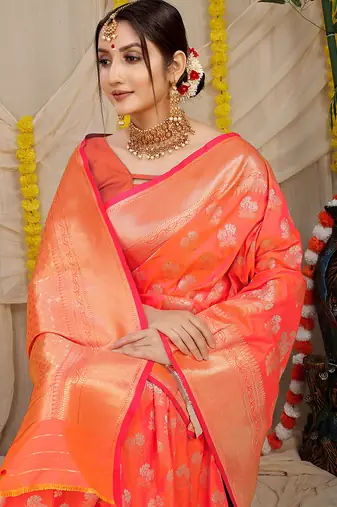 Peach orange banarasi silk blend saree with zari floral weaving & rich pallu