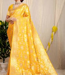Mustard yellow banarasi silk blend saree with rich gold zari floral weaving