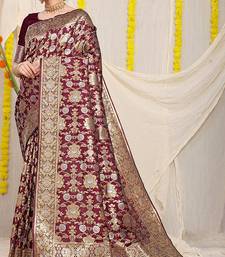 Wine banarasi silk blend saree with rich gold zari floral weaving
