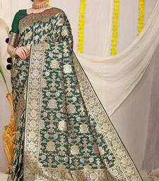 Bottle green banarasi silk blend saree with rich gold zari floral weaving