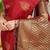 Crimson red banarasi silk blend saree with gold leaf buttis & woven border