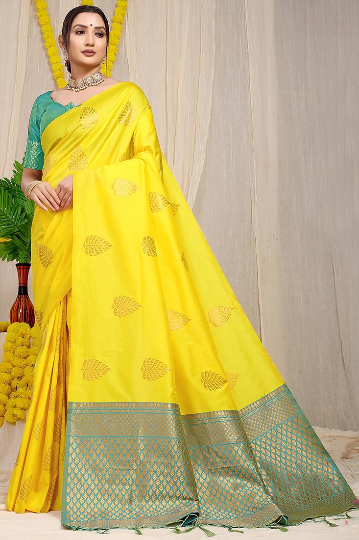 Yellow banarasi silk blend saree with gold leaf buttis & woven border