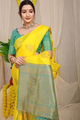 Yellow banarasi silk blend saree with gold leaf buttis & woven border