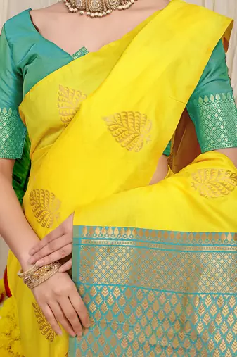Yellow banarasi silk blend saree with gold leaf buttis & woven border
