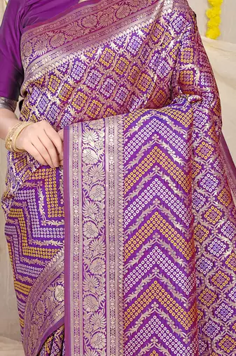Purple banarasi silk blend saree with bandhani patola print and zari border