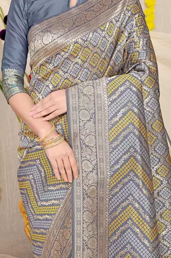 Grey banarasi silk blend saree with bandhani patola print and zari border