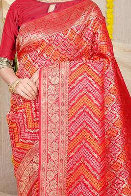 Red banarasi silk blend saree with bandhani patola print and zari border 4