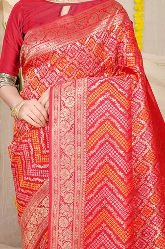 Red banarasi silk blend saree with bandhani patola print and zari border