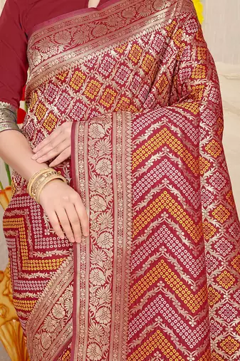 Maroon banarasi silk blend saree with bandhani patola print and zari border