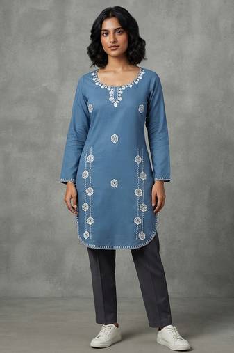 Blue embroidered kurti with dark trousers