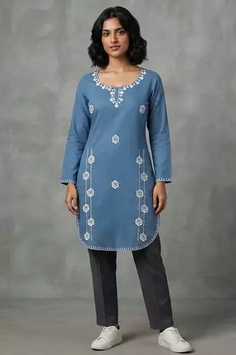 Blue embroidered kurti with dark trousers
