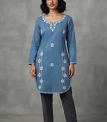 Blue embroidered kurti with dark trousers