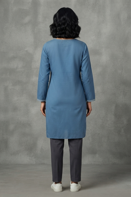 Blue embroidered kurti with dark trousers 2