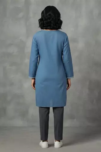 Blue embroidered kurti with dark trousers