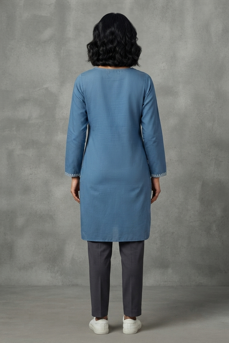 Blue embroidered kurti with dark trousers