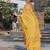 yellow color linen digital printed saree with running print blouse