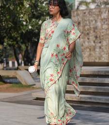 pista green color linen digital printed saree with running print blouse