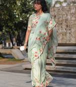 pista green color linen digital printed saree with running print blouse