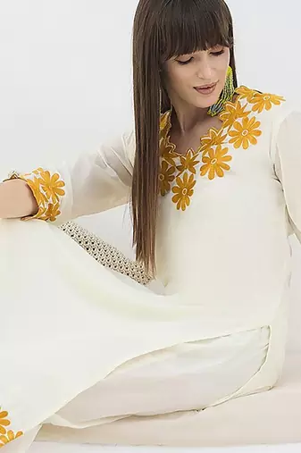 Women Floral Embroidered Cotton Kurta with Trousers