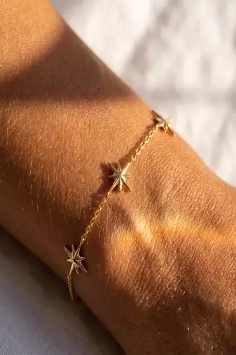 Elegant Gold Tone Starburst Charm Chain Bracelet