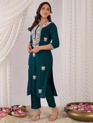 Women Embroidered Regular Kurta with Trousers 4