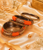 Stone embellished orange seed bead bangles