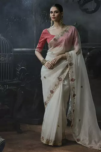 Off-white tissue silk blend embroidered saree with pink blouse