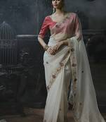 Off-white tissue silk blend embroidered saree with pink blouse