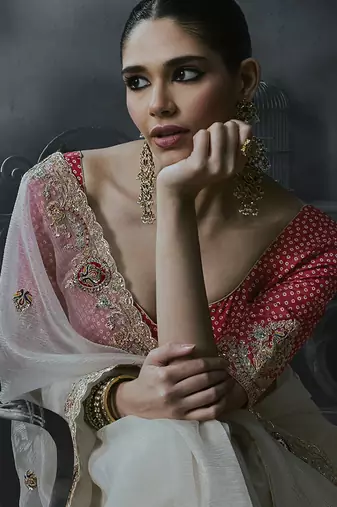 Off-white tissue silk blend embroidered saree with pink blouse