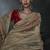 Beige tissue silk blend embroidered saree with red blouse
