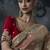 Beige tissue silk blend embroidered saree with red blouse
