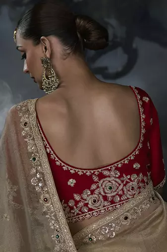 Beige tissue silk blend embroidered saree with red blouse