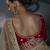 Beige tissue silk blend embroidered saree with red blouse