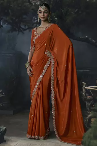 Orange tissue silk blend embroidered saree with blouse