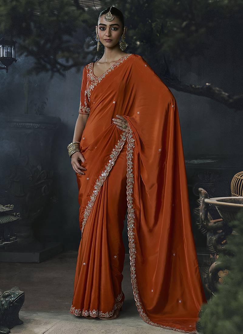 Orange tissue silk blend embroidered saree with blouse