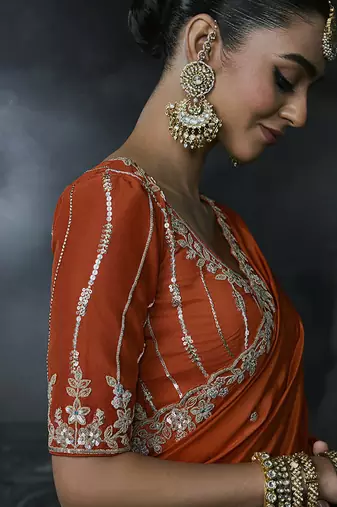 Orange tissue silk blend embroidered saree with blouse