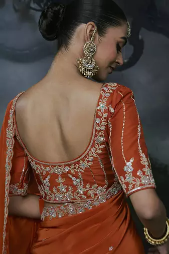 Orange tissue silk blend embroidered saree with blouse