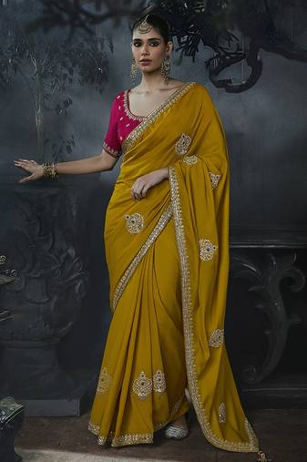 Mustard yellow tissue silk blend embroidered saree with rani pink blouse