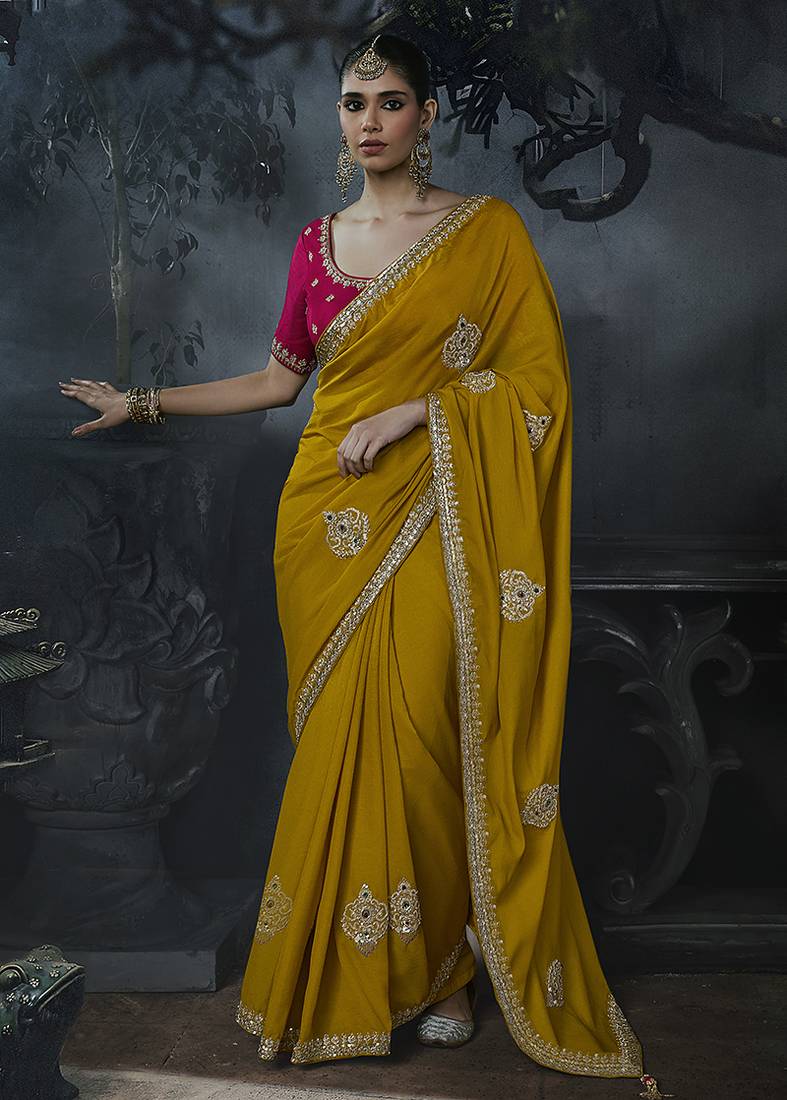 Mustard yellow tissue silk blend embroidered saree with rani pink blouse