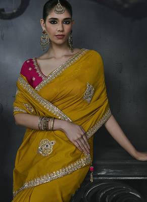 Mustard yellow tissue silk blend embroidered saree with rani pink blouse 3