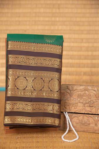 Dual tone green and brown traditional silk saree with blouse