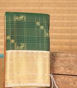 Bottle green zari kattam semi silk saree with blouse