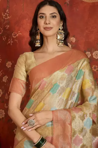 Beige tissue woven design saree with unstitched blouse piece.