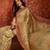 Beige tissue woven design saree with unstitched blouse piece.