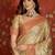 Beige tissue woven design saree with unstitched blouse piece.