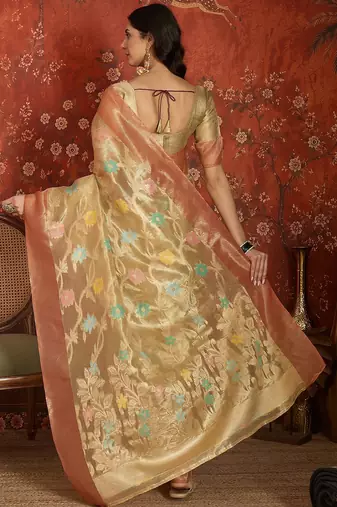 Beige tissue woven design saree with unstitched blouse piece.