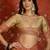 Beige tissue woven design saree with unstitched blouse piece.