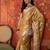 Gold tissue woven design saree with unstitched blouse piece.